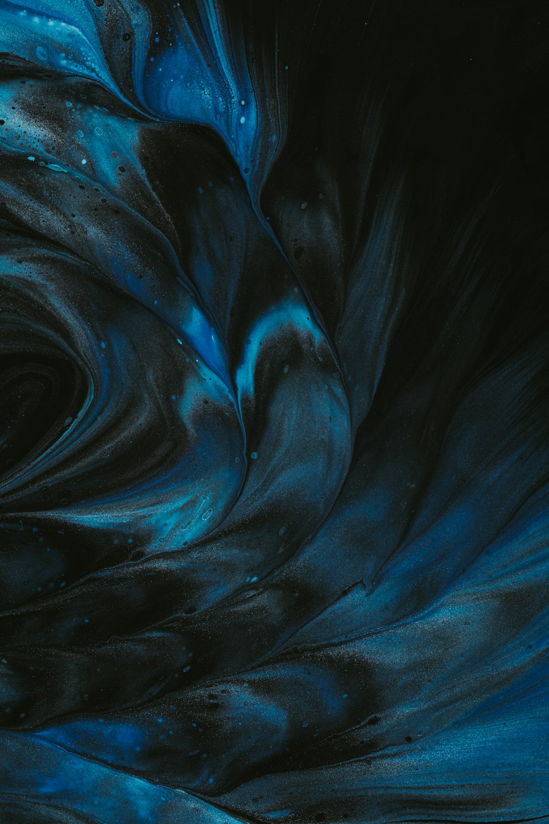 Black and blue swirls in the dark, hyper realistic and detailed, cinematic photography, high resolution photography, super detailed, ultra photorealistic in the style of extreme wide shot from a low angle. –ar 85:128