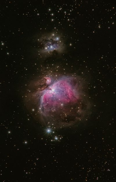A deep space photo of the nebula in an analog style, featuring a theorized nebula with sharp details and vibrant colors, with a double exposure of the M42 Orion constellation and its reflection on a black background. The photo was taken with a Canon EOS R5 camera with a Nikon AF-S T TV lens at an f/8 aperture setting and ISO 600 for best image quality in the style of an unnamed artist. --ar 81:128