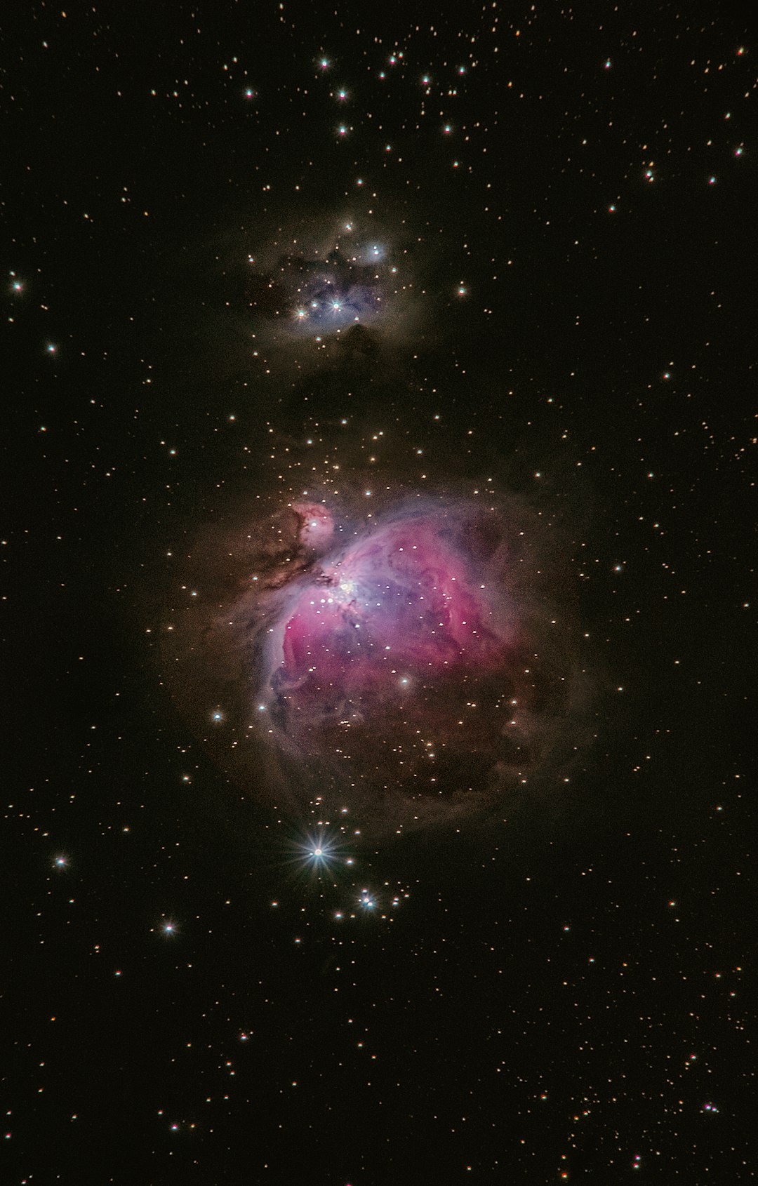 A deep space photo of the nebula in an analog style, featuring a theorized nebula with sharp details and vibrant colors, with a double exposure of the M42 Orion constellation and its reflection on a black background. The photo was taken with a Canon EOS R5 camera with a Nikon AF-S T TV lens at an f/8 aperture setting and ISO 600 for best image quality in the style of an unnamed artist. –ar 81:128