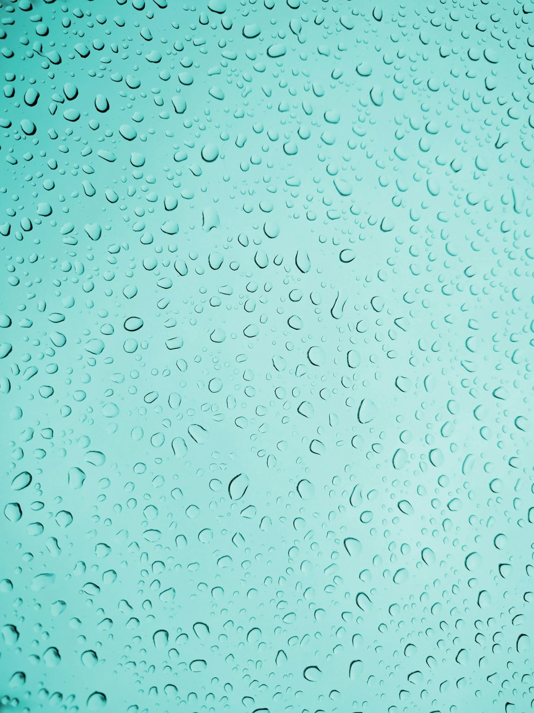 Water droplets on glass, turquoise background, high resolution, professional photograph, The ultrahigh definition picture shows extremely realistic and intricate details of the scene. High quality photography, clean sharp focus –ar 3:4