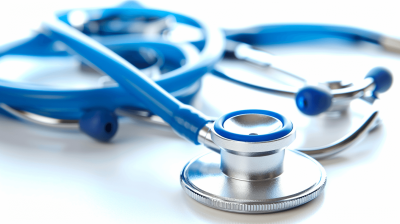 Close up of a blue stethoscope on a white background. A high detail, sharp focus stock photo of a closeup. Studio photography of an isolated stethoscope on a clean white background with professional color grading and soft shadows. No contrast, clean sharp focus.