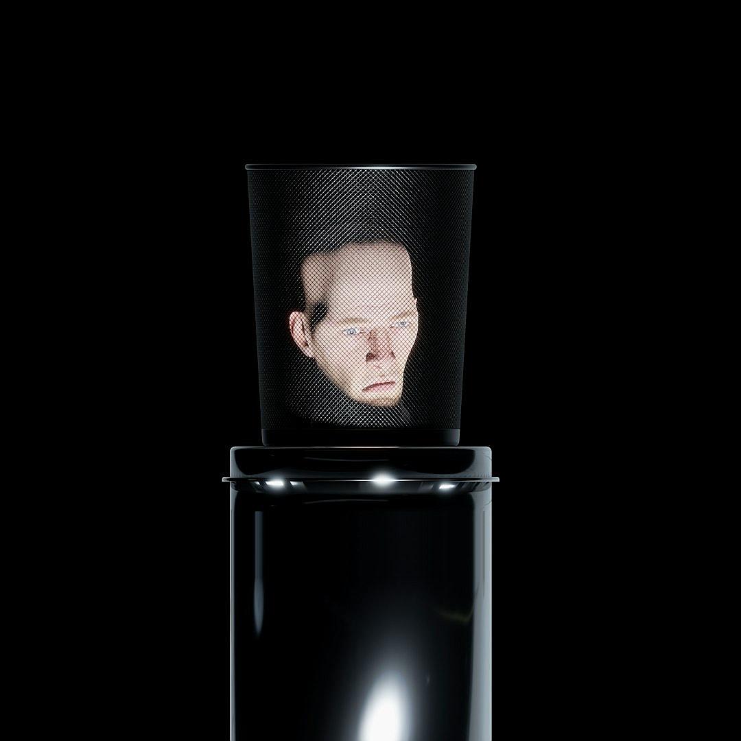 a translucent cup with the face of young man projected on it, placed over an empty black cylinder on dark background, hyper realistic photography