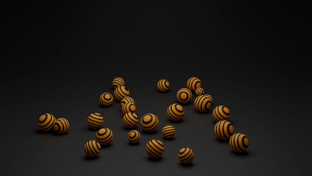 A few golden striped wooden spheres on a black background in the style of minimalism. 3D rendering created in the style of C4d and blender.