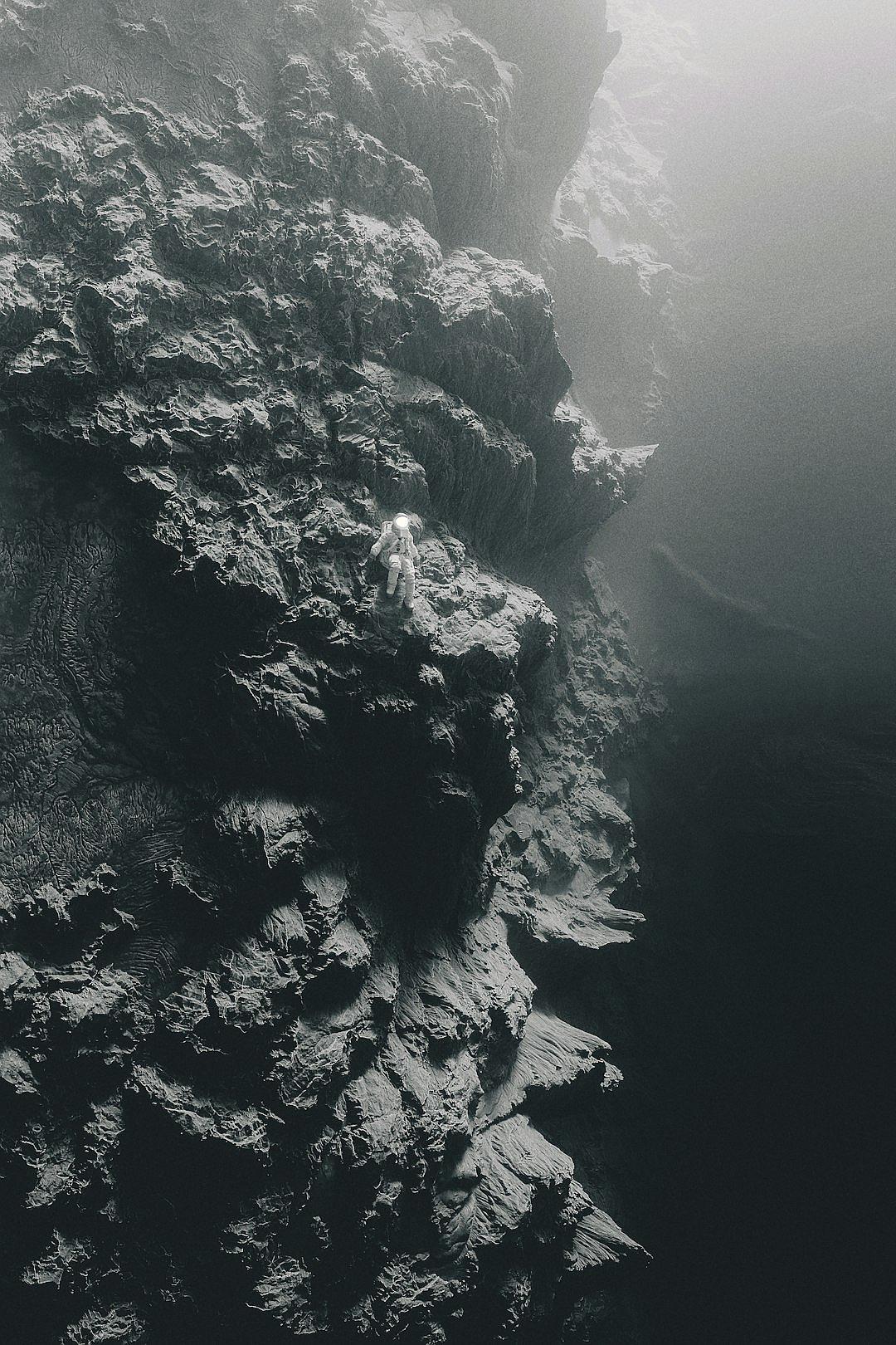 A vertical black and white photograph of the rugged cliffs on an island in Iceland, taken from above with mist swirling around them. The cliff’s texture is detailed as it contrasts against the dark sea below. A lone mermaid hovers just over her head, adding to the mysterious atmosphere.