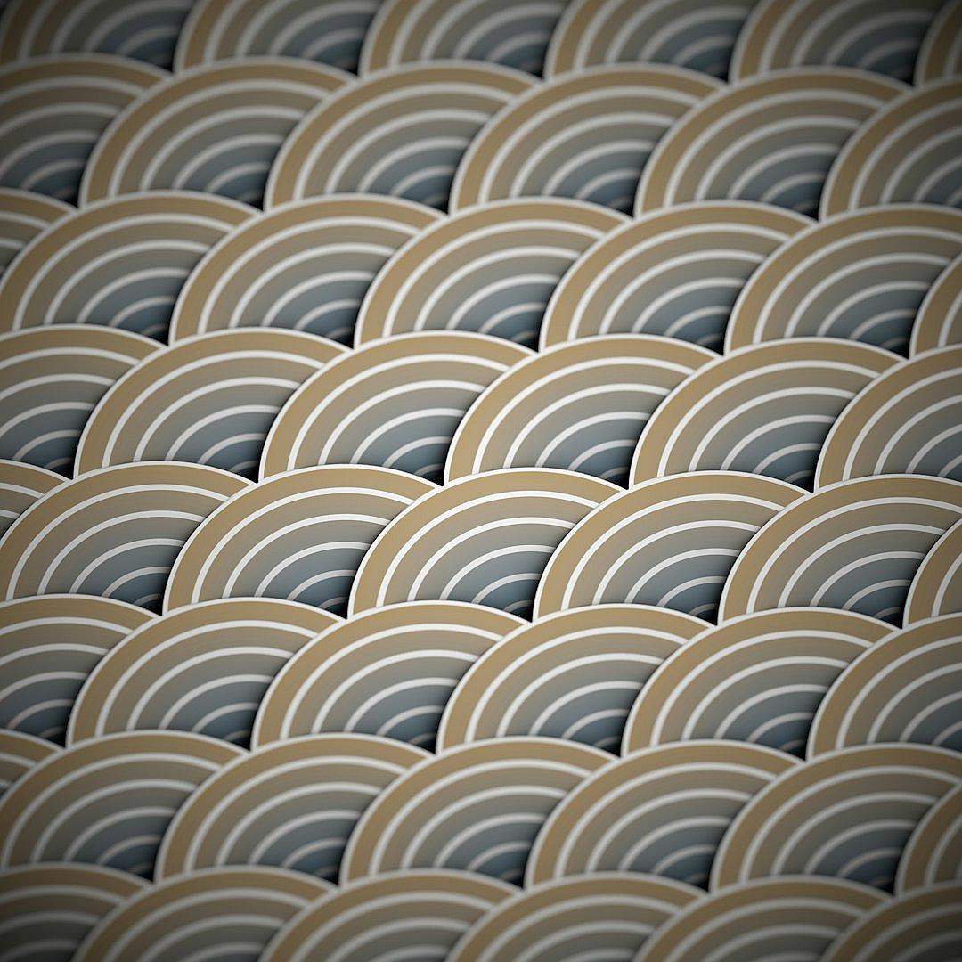 A pattern of overlapping circular shapes in varying shades of beige and grey, creating an elegant design that resembles the scales on fish bodies. The background is a dark gray to contrast with the light colors of each circle. This pattern creates depth through its interplay between curves and straight lines, giving it both movement and stillness at once. It would be suitable for high-end fashion or interior decor, adding elegance without being too overdone.