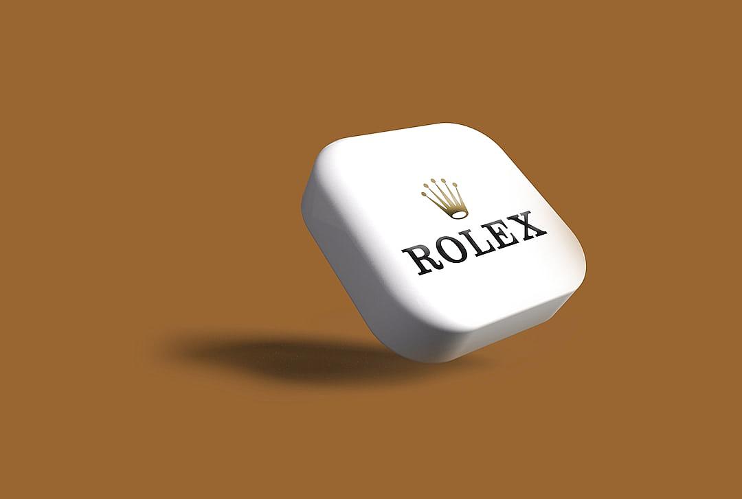 3D render of a white cube with a Rolex logo on it floating in the air against a solid brown background in the style of hyper realistic minimal editing of the original text.