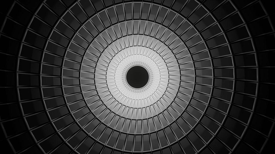 Black and white background, circular pattern, symmetrical composition, symetrical, circular ceiling. High contrast, indoor environment, wideangle lens, high saturation, bright light source, cool tones, static feeling. Black circle in the center of black lines, symmatrically arranged. Monochrome tone, high definition photography. ,32K HD