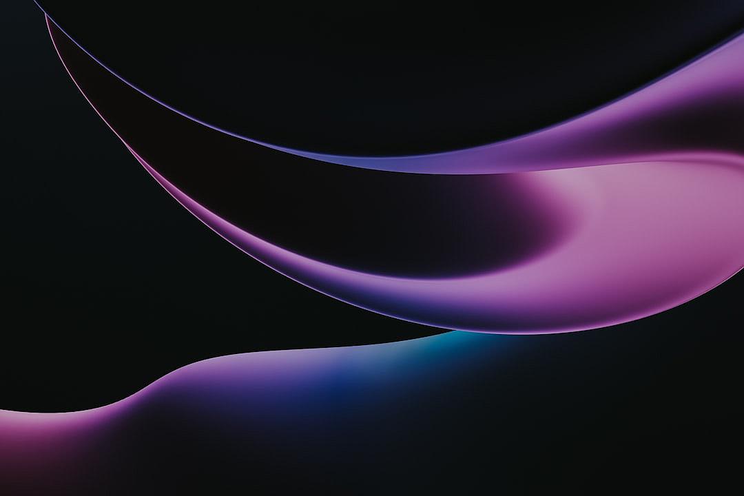 Abstract purple and blue shapes on a black background, with smooth curves and soft edges. A gradient dark background with low light and shadows. Digital art in a minimalist style inspired by zen, focusing on the curved line shapes with subtle gradients. A clean, elegant and simply designed wallpaper with an abstract background. Digital art featuring smooth gradients in dark colors as a high detail, sharp vector illustration with high contrast and high definition.