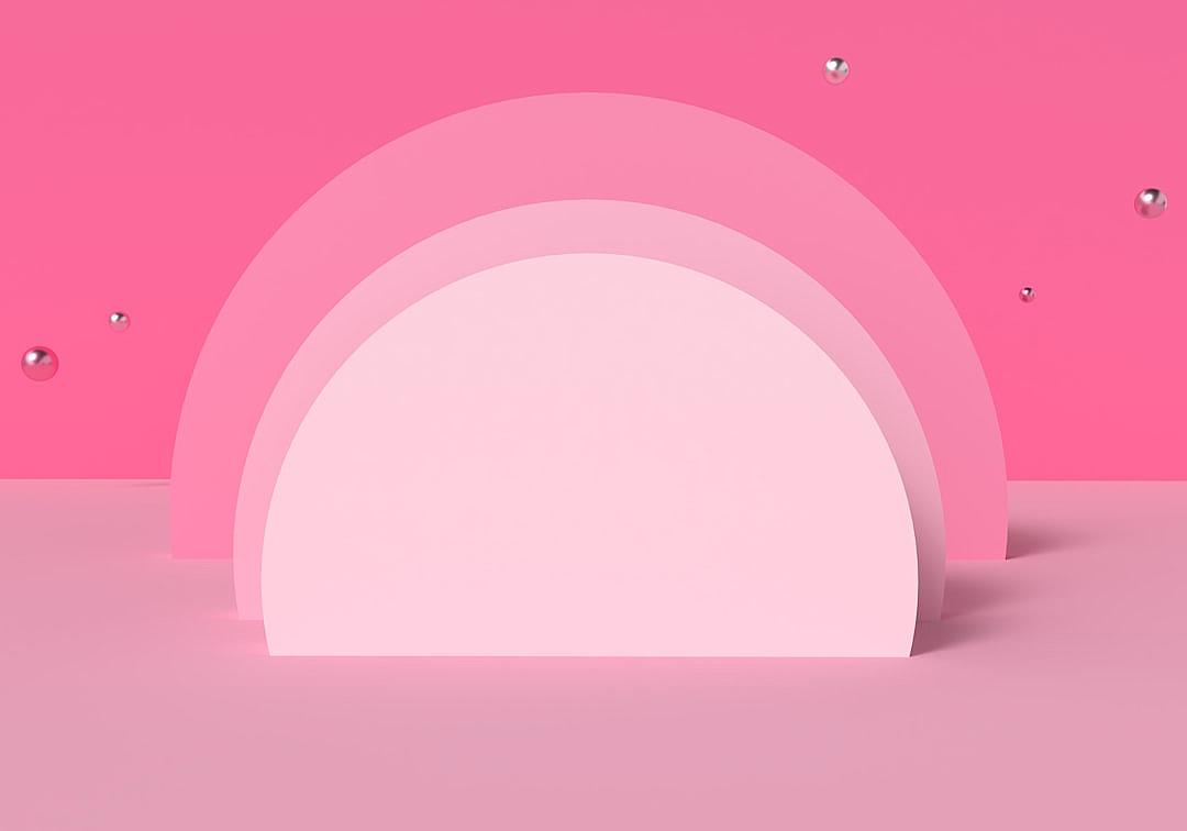 3D rendering of a pink background with two semicircular shapes on the right and left sides. The shape is made up of three arches, which form an arc in front of it. There is some space between them that creates depth and movement. Above or below these arches there could be some floating spheres to add detail. This design would work well for product display, showcasing items such as cosmetics, accessories, etc., with its soft color tones creating a gentle atmosphere in the style of a product designer.