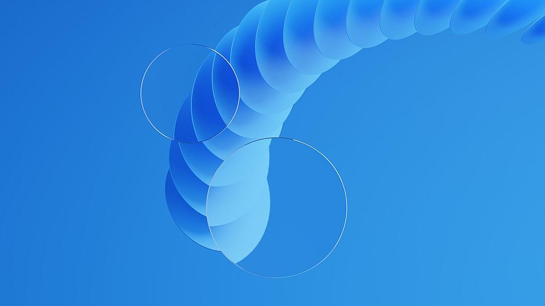 Blue background, a few semitransparent circles on the right side of an Sshaped curve with rounded edges in the center, blue gradient color scheme, minimalist style, circular composition, and circular elements on both sides. The entire scene is composed using C4D software, presenting a highdefinition and detailed effect. It embodies lightness and transparency through Octane Render technology. This creates a sense of modernity and elegance.