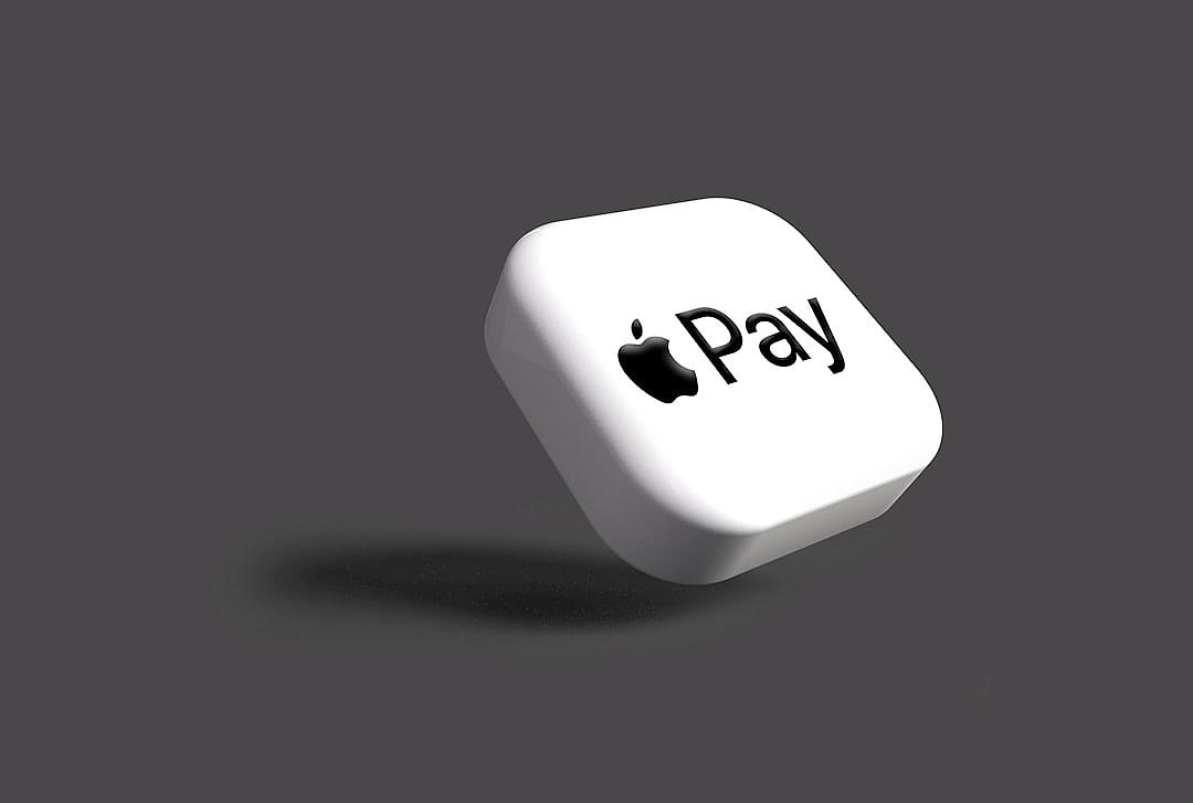 3D white apple payment button with the text “pay” on it, floating in air against a simple gray background with clean lines and high contrast in the minimalistic style of high resolution and no shadows. The hyperrealistic render was done in Octane.