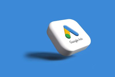 A white button with a logo of google ad on it, floating in midair, on a blue background, high resolution, highly detailed, with shadows and highlights, in the style of Apple's design team, ui/ux, app icon design, award winning UI design, clean, minimalistic, white, green, yellow color details, illustration, 3d render, octane rendering, HDR.