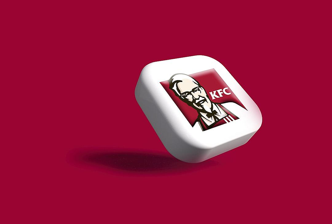 A white square button with the KFC logo on it, featuring an ultrahighdefinition and realistic design style, with a solid color background. The red surface is in high definition, with 3D rendering and is presented as a floating object. It has an overall composition of 40 megapixels.