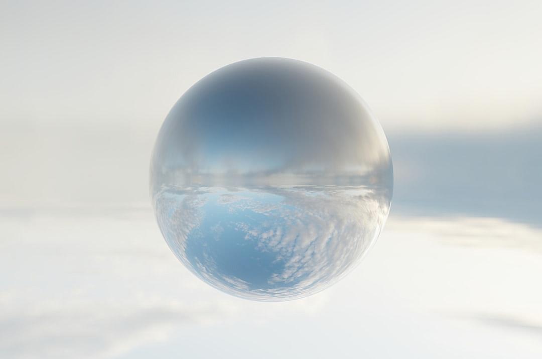 A transparent glass sphere floating in the air, with clouds inside, rendered in the style of cinema4d, minimalist stage design, and a white background. The sky is reflected on its surface, creating an ethereal atmosphere. It has soft edges and delicate textures, and the overall color tone should be a cool blue to complement the sky reflection effect. High resolution.