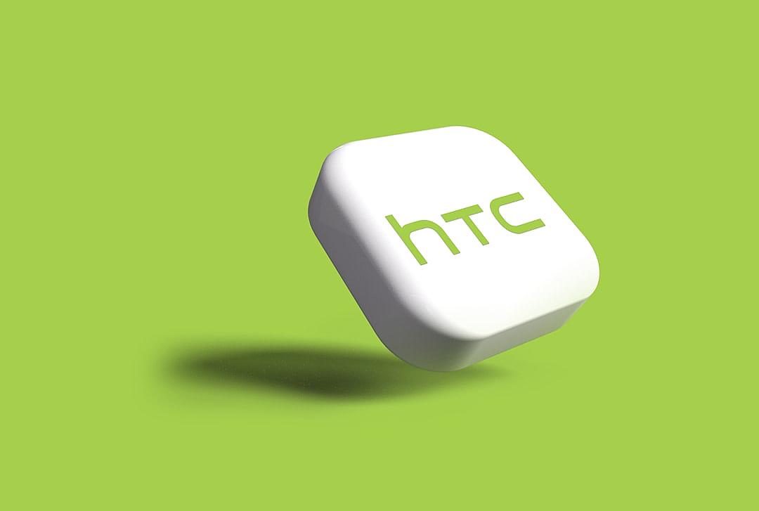 A white rounded rectangle with the “HTC” logo on it floating in midair against a green background, rendered in the style of [Rob Janoff](https://goo.gl/search?artist%20Rob%20Janoff) as an isometric rendering with a soft shadow cast behind it. The lighting should be soft yet vivid to highlight its contours and edges, creating a sense of depth that suggests motion or dynamic energy. This design style would emphasize simplicity while maintaining visual appeal through a style reminiscent of cubism and isotype. Isolated on a plain green background.