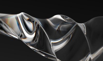 3d render of fluid glass abstract shape, black background,