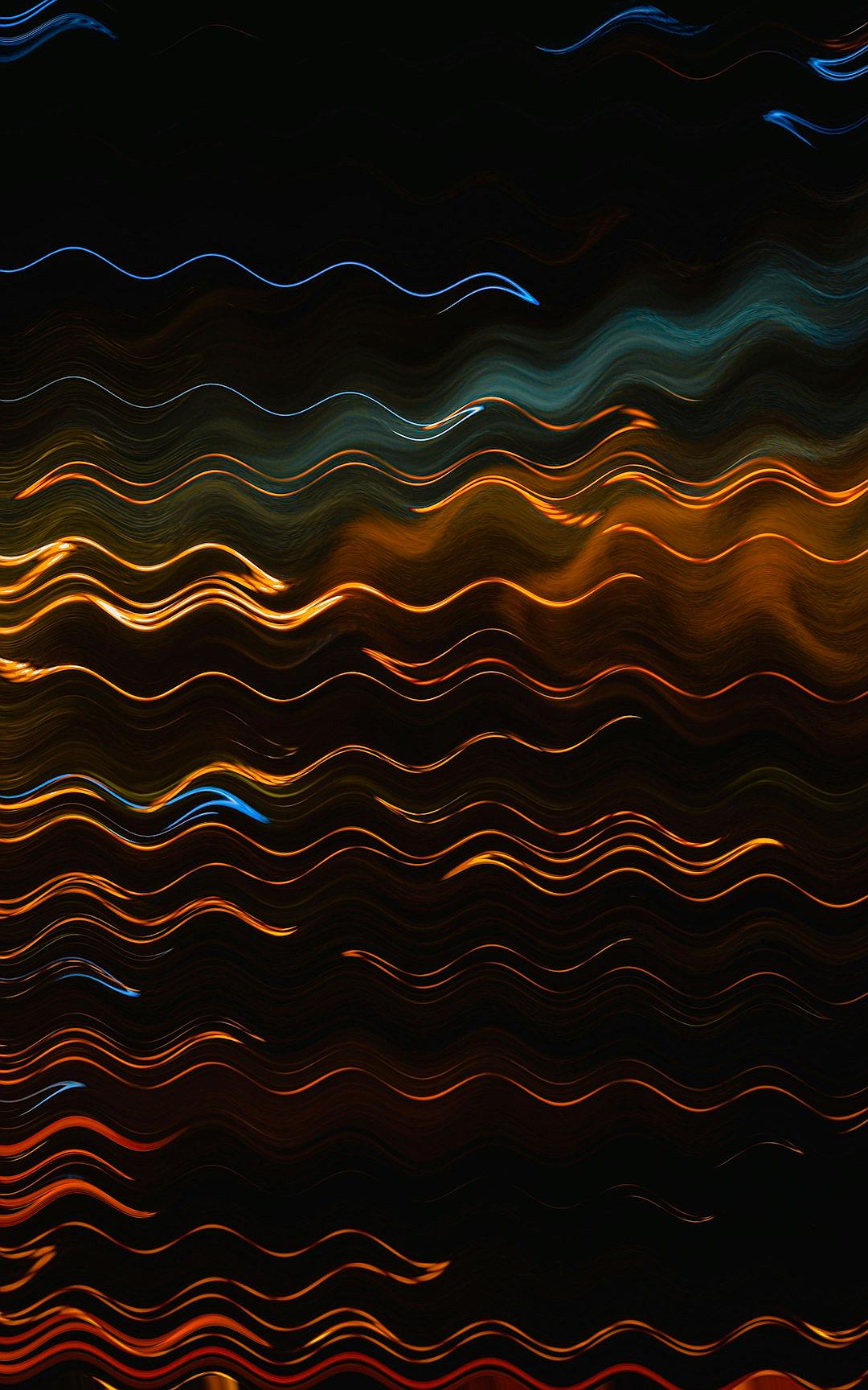 A dark background with colorful lights in the shape of wavy lines, creating an abstract and dynamic pattern. The colors include blue, orange, red, yellow, and green, giving it depth and vibrancy. This is suitable for use as a phone wallpaper or digital art design. It’s a highresolution image that captures light streaks with motion blur to give movement and energy to the composition.