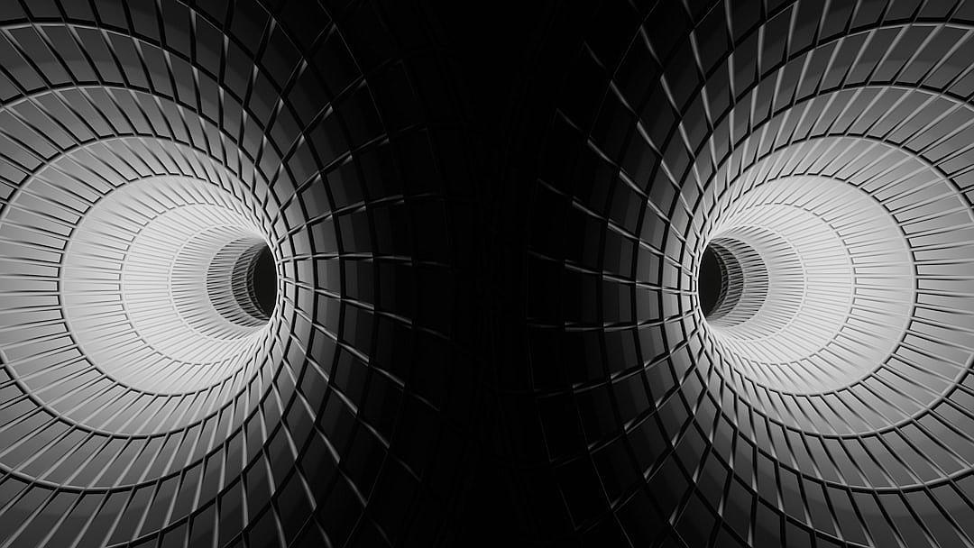 A symmetrical composition of two circular structures, one on the left and another on the right side, both glowing with white light against a black background. The structures have vertical lines and circles in gray color, creating an abstract pattern. In the style of Black & White photography, with sharp focus on each spiral shape.