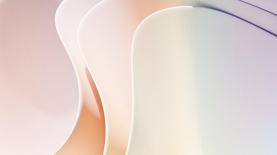 A closeup of three curved paper shapes in pastel colors, set against an abstract background with soft lighting. The focus is on the smooth curves and subtle gradients creating a harmonious composition. Highquality digital illustration with attention to detail for a modern aesthetic.