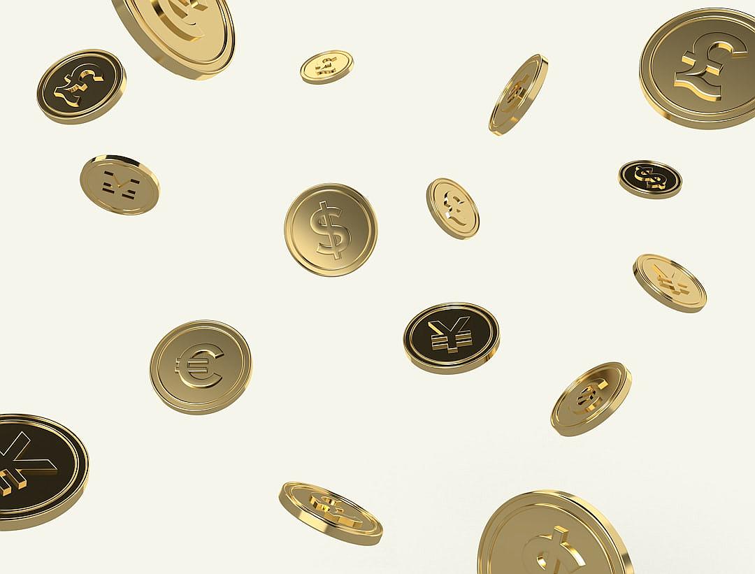 Many gold coins with various currency symbols floating in the air against a simple white background with space at the top and bottom. The coins are rendered in 3D with high resolution, quality, detail, definition and contrast as well as high color exposure and brightness. The background is white without shadows, reflections or blur.