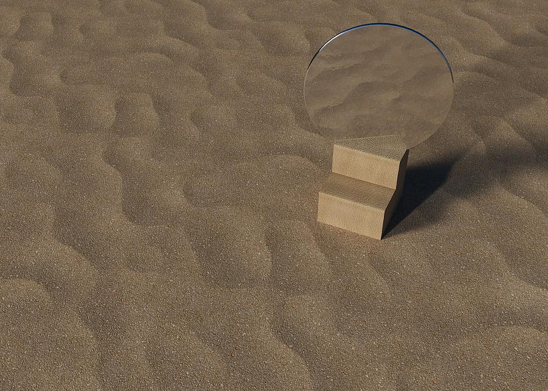 In the middle of an endless desert, there sits a small round mirror on three short wooden blocks. The background features smooth sand with no textures or shadows present. The scene is depicted in the style of minimalism.