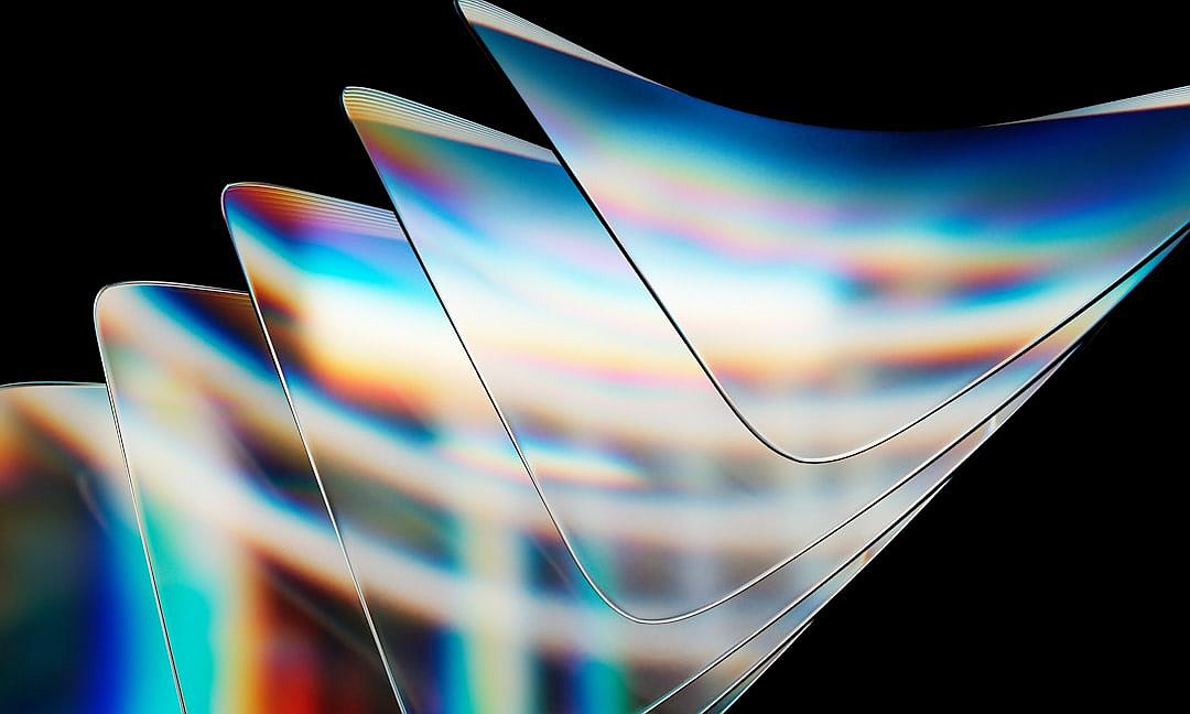 An abstract composition of light refraction on paper sheets, in the shape of curved wavelike shapes with different colors and tones against a dark background, captured with high resolution photography in the style of a Hasselblad X2D50C camera.