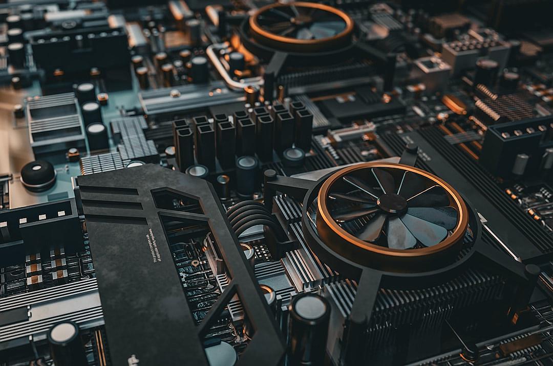 A closeup of the intricate design and components on an elegant gaming computer with high-end coolers, fans, and aesthetics. The background is a complex circuit board filled with technology elements like transistors and wires. Captured in a studio setting using professional photography techniques to highlight details in the style of a circuit board filled with technology elements.