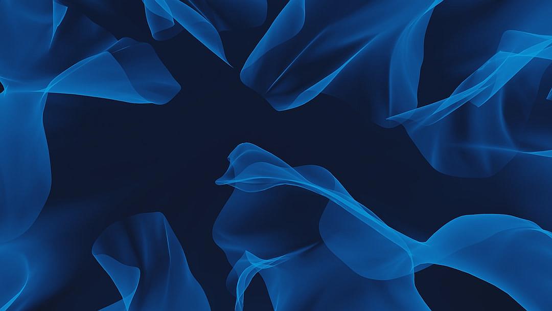 Blue background with abstract shapes floating in the air against a dark blue background. The abstract shapes are done in the style of blue.