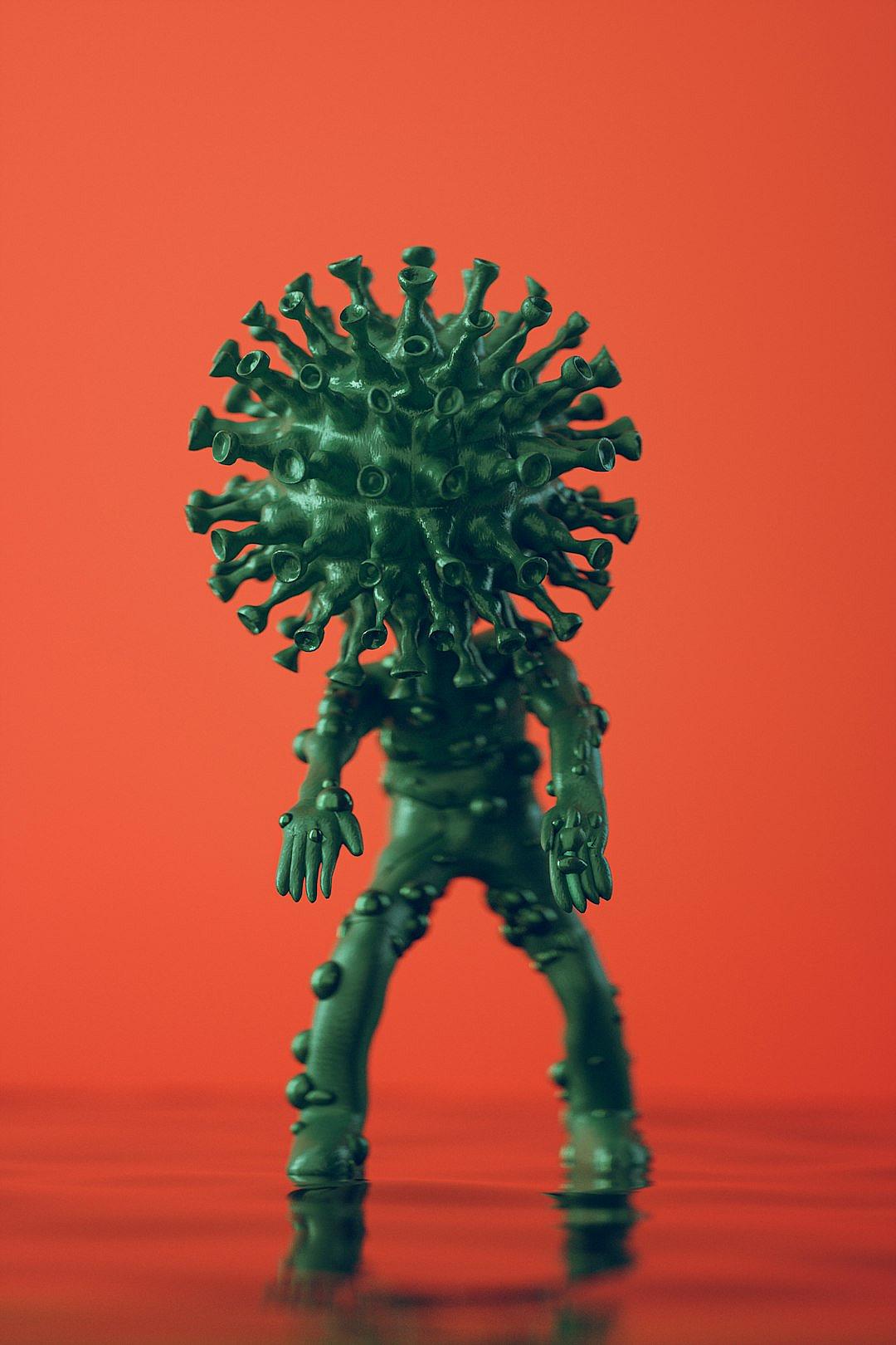 A green plastic toy figure of the Korean virus is standing on its head, with many sharp spines growing from its back and top. The background color is red, with minimalist photography and a simple background. It is macro photography with a clean and simple design, studio lighting, and high resolution.