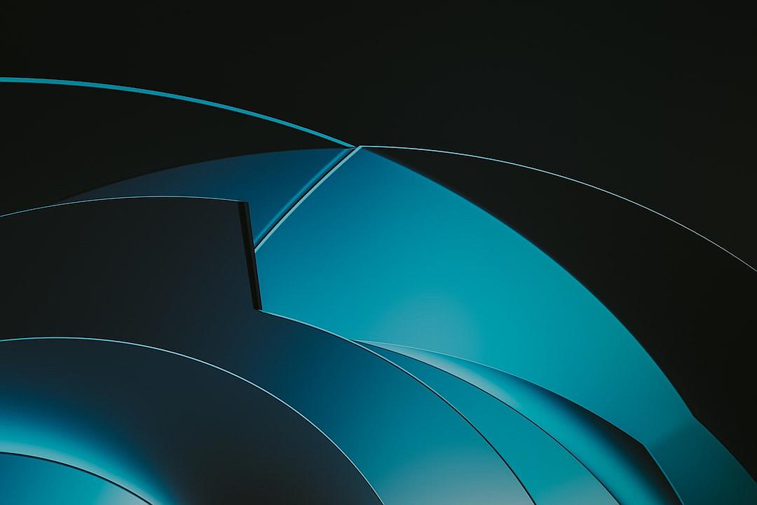 A black background with a blue gradient and three curved lines in the center, all in dark tones. The shapes of these curves resemble an abstract representation of futuristic elements or technology. They appear to be made from metal material with a glossy finish, giving them depth and texture. There is no text visible on screen, just the soft glow against the darkness created by the gradient. This visual style creates a sense of modernity and minimalism, suitable for highend design projects.