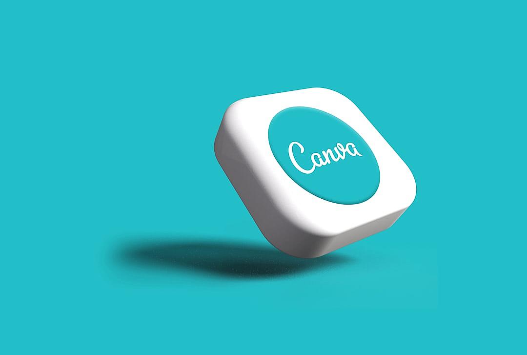 A white and teal button with the word “Canea” on it floating in midair, against an isolated turquoise background. The button is squareshaped and has rounded corners. It features soft shadows under its surface to give depth of field effect. A small shadow from underneath the button suggests that there’s another object beneath or near it. This design highlights contrast between light blue background color and dark gray font, creating visual harmony.