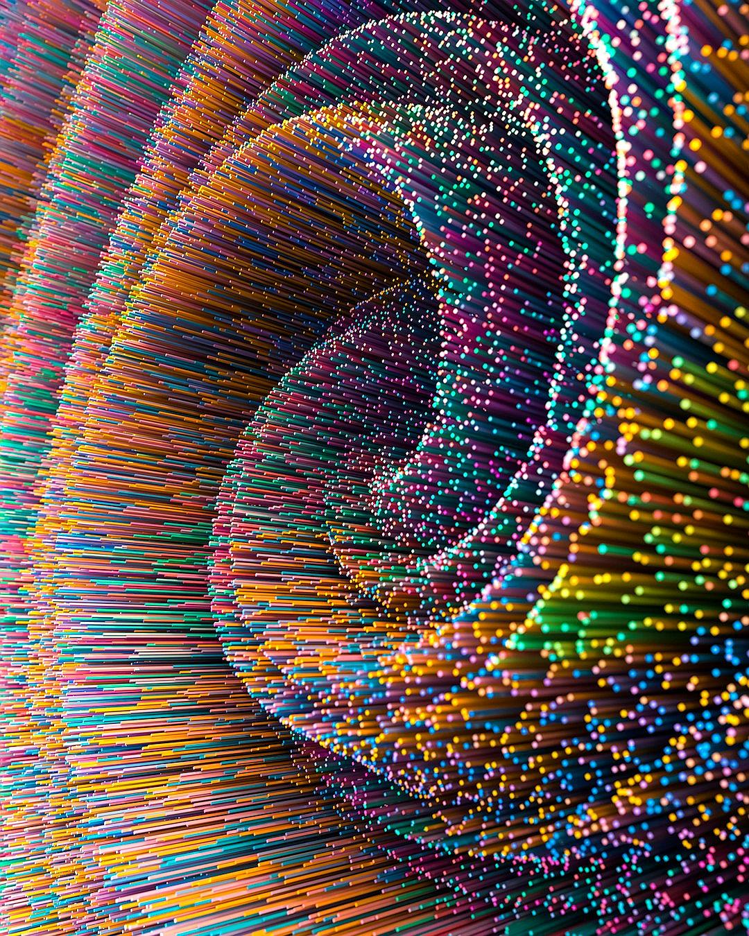 A detailed photo of an immersive installation made from thousands of colorful tiny sticks, forming the shape of multiple spirals and curves inside a dark room. The low angle shot macro photography creates a depth effect with perspective blur between the background and foreground elements. Vibrant colors are featured.