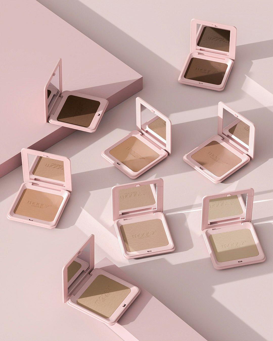 A collection of square powder flameless packaging with the brand name “Picto”, the colors are beige, pastel pink and soft green, on top there is an open mirror. The palette contains three shades of blavadise cream for face makeup, lying in different positions on a light background, with a minimalistic design, in the style of product photography.