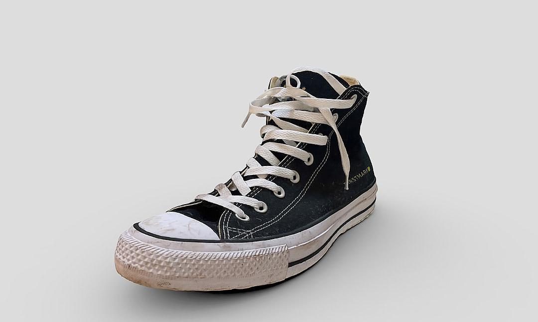 Black high tops with white laces, ultrarealistic, on a transparent background. The shoes have worn and dirty edges to give an aged look, showcasing the classic Converse style. They appear slightly distressed but still in good condition, perfect for product images in the style of all leather shoes.