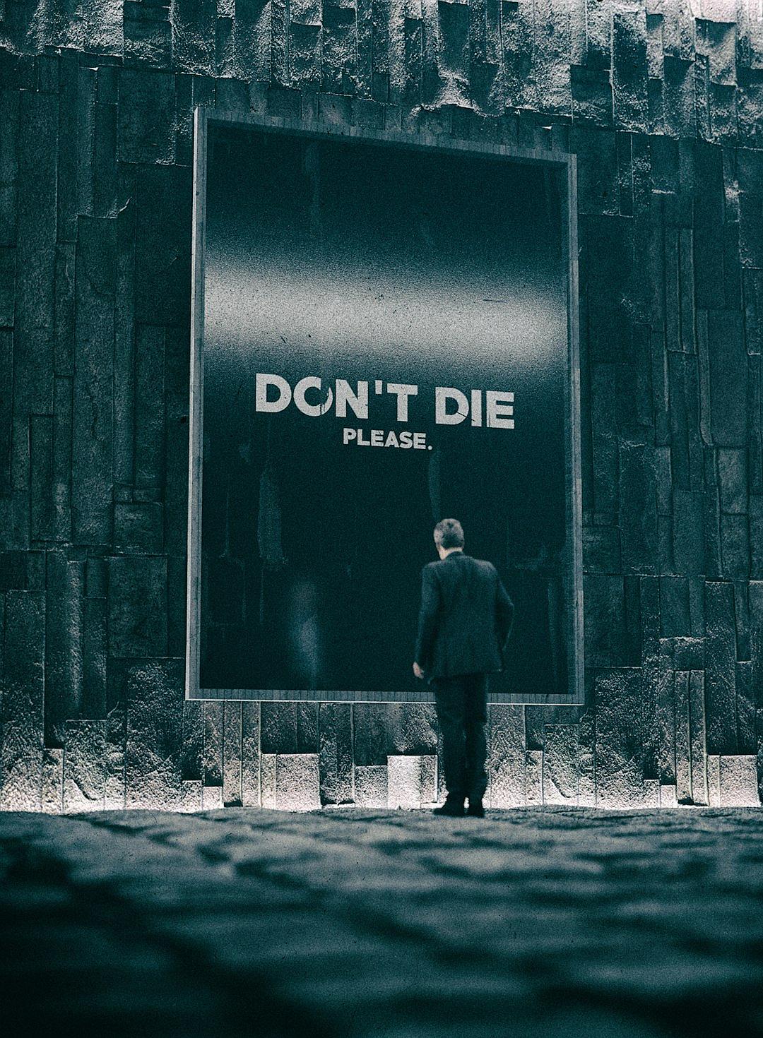 A man in a suit stands next to a big billboard with the text “DON’T RUN DIE”. The scene is in dark grey and black colors, creating a dark atmosphere with a gloomy vibe. The photo was taken in the style of Canon EOS R5.