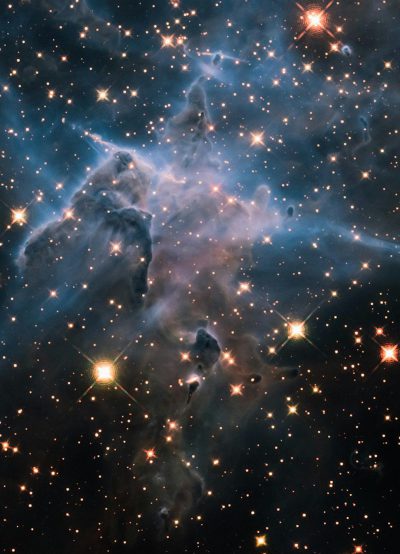 A photograph of the Hubble Space Telescope's view of the Cleveland dwarf nebula in space, with nebular clouds and stars. The photo is taken from an extreme closeup perspective, capturing intricate details with high resolution. It showcases a deep blue color scheme with hints of bright starlight, creating a mesmerizing scene of cosmic beauty in the style of the Hubble Space Telescope.