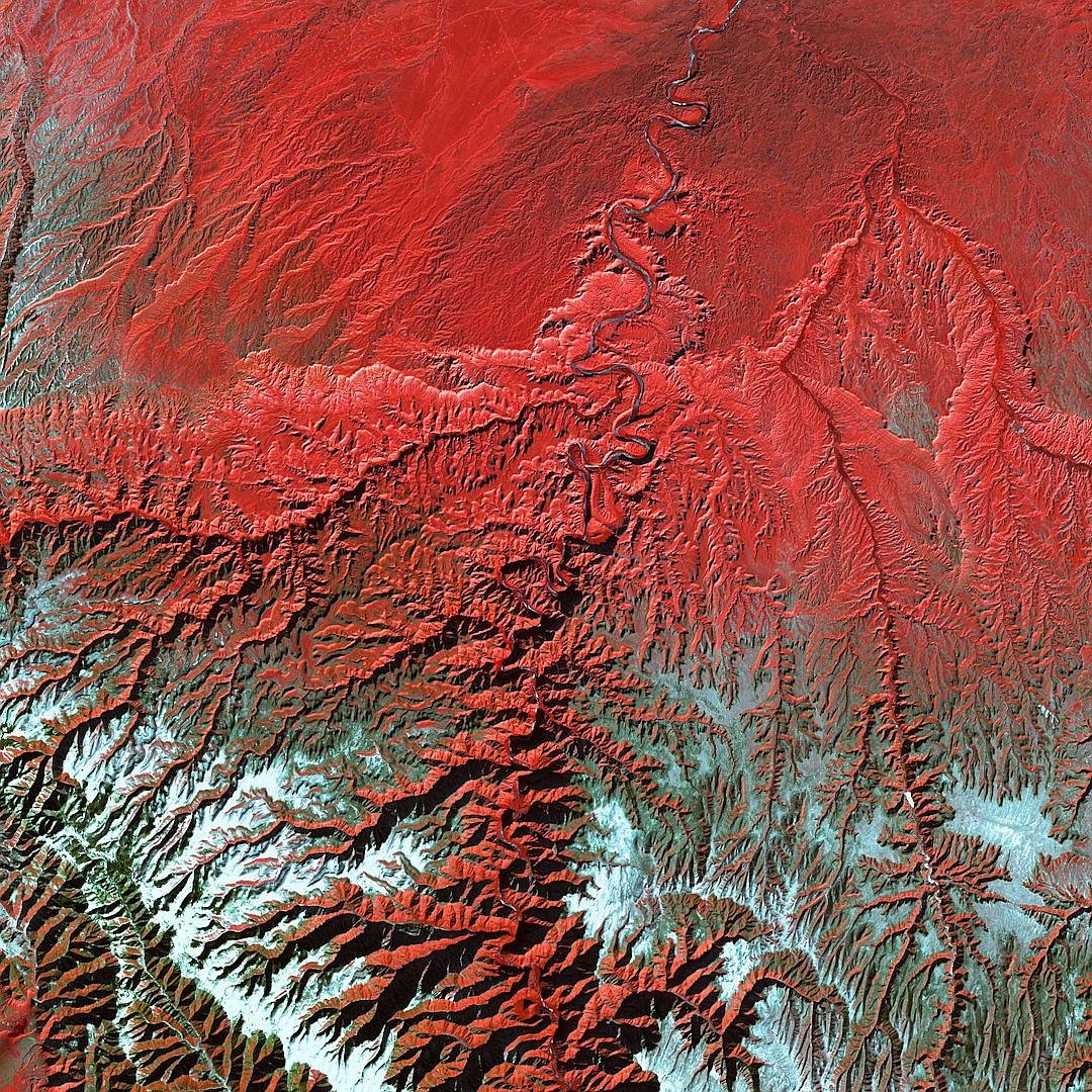 red color gradient satellite photo of the Himalayas, white snow on red mountainous terrain, highly detailed, high resolution