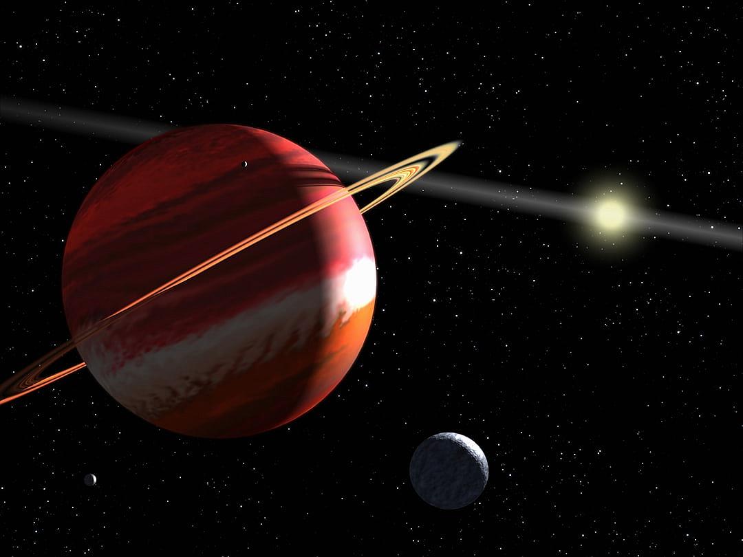 Red gas giant planet with rings and two moons, black background, stars in the sky, concept art by Pixar