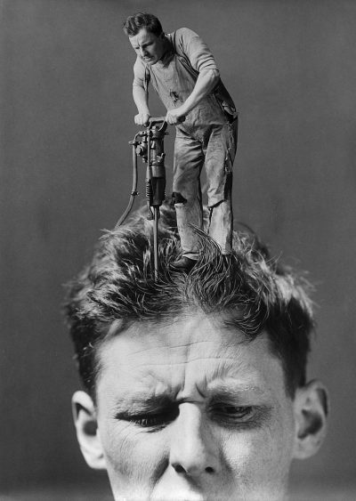 A man with an electric drill in his hair, another person is standing on the head of that guy and repairing it, in the style of [Ralph Horsley](https://goo.gl/search?artist%20Ralph%20Horsley). Tom Street [Charles Spencelayh](https://goo.gl/search?artist%20Charles%20Spencelayh) Meriald, black and white photo from the 1920s, minimalism, simple background, high resolution, hyperrealistic, high detail.