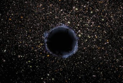 A black hole in the middle of space, surrounded by stars, with an allblack background.