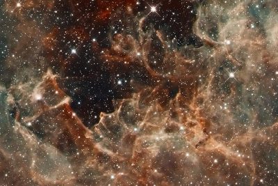 A closeup of the James Webb Space Telescope's first light, capturing details in nebula clouds and distant stars. The focus is on intricate patterns within gas cloud formations, with highlights showing cosmic dust particles. In hues of reds, oranges, and blues, it captures celestial beauty in its purest form. This high-resolution photograph reflects a blend between realism and fantasy elements in the style of Hubble's images. It evokes wonder at the vastness of space.