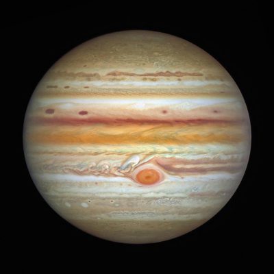 Jupiter, the planet with red and orange stripes, has an extra spot on its surface, which adds to it's beauty.