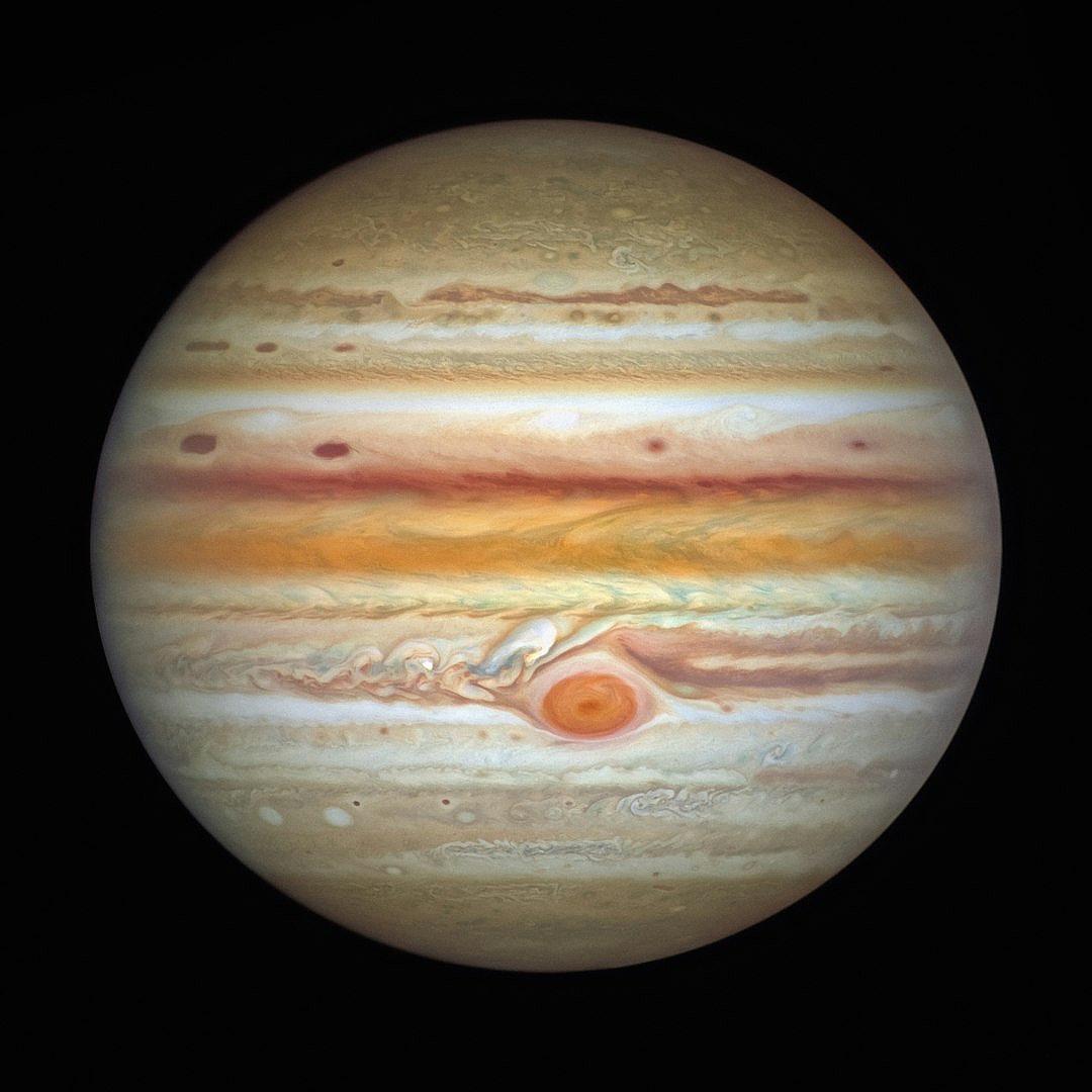 Jupiter, the planet with red and orange stripes, has an extra spot on its surface, which adds to it’s beauty.