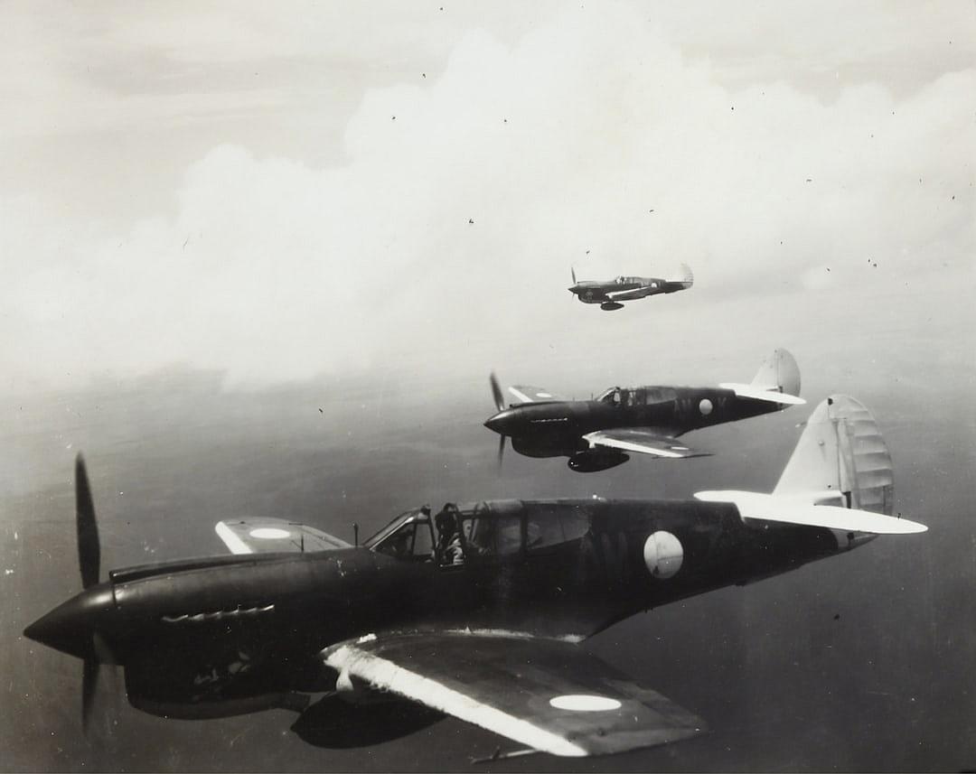 Old black and white photo of Japanese P40 WarHorns flying in formation over Japan, 2 World war 2 fighter planes flying side in the style of side, 3 World war 2 airplane, 5 world war two aircrafts, vintage photograph on film, old black & White photography, very detailed photo realistic photography, very sharp focus, very high resolution, very intricate details, very good detail