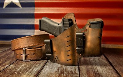 A brown leather gun holsters with the texas flag in background, product photography