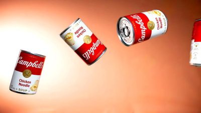 Canned soup flying through the air, "campbell's chicken noodle", with the "campbells" logo on the cans, against an orange background, with the white and red can colors, in a style of commercial photography, appearing ultra realistic.