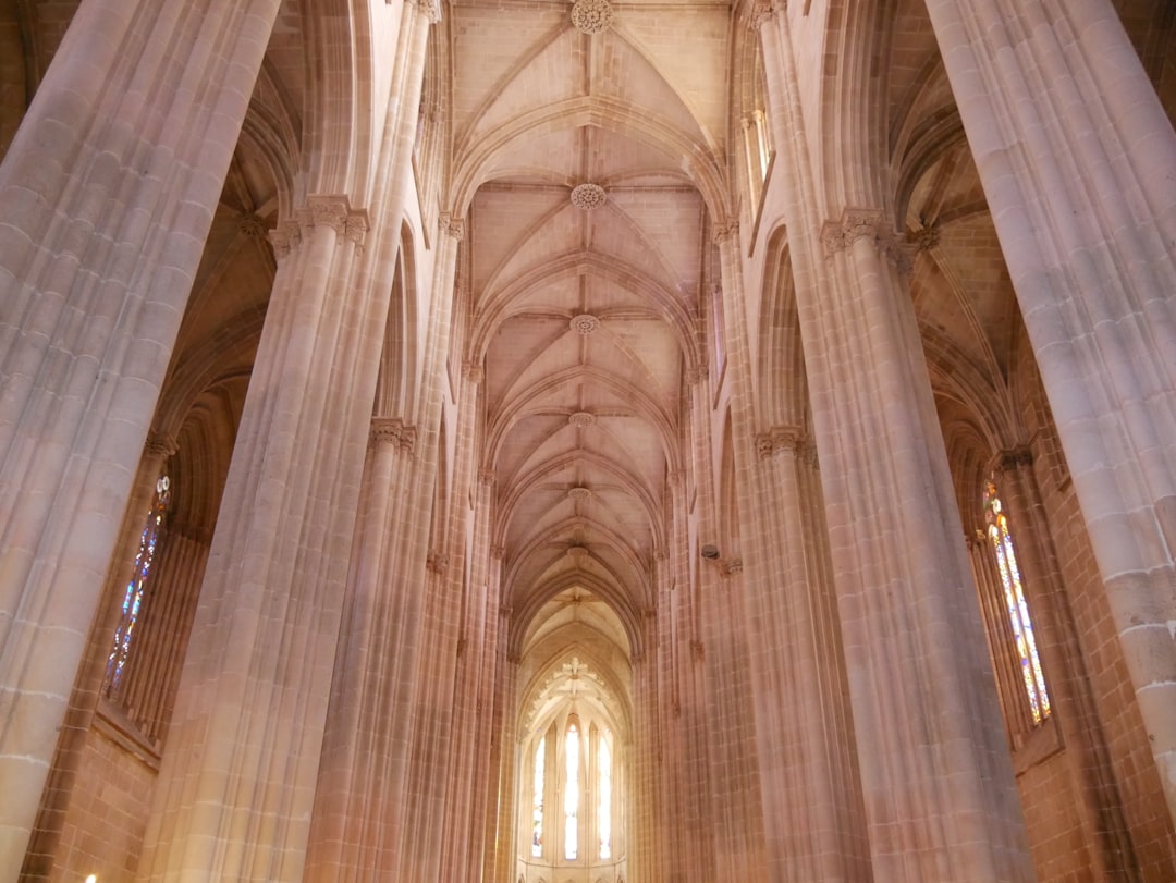 interior of the gothic cathedral, inside view of pillars and vaults in beige stone, portugal –ar 4:3