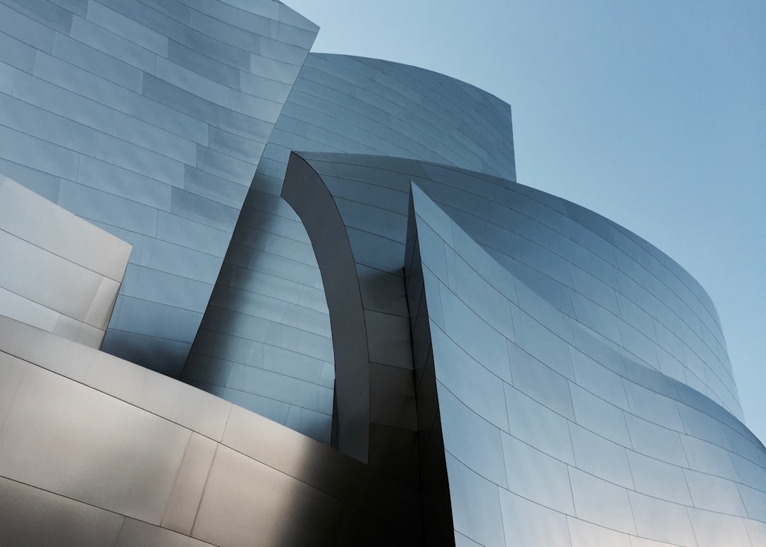 The Disney beast building in Los Angeles, close-up of the architecture, photographed in the style of [Iwan Baan](https://goo.gl/search?artist%20Iwan%20Baan). –ar 128:91