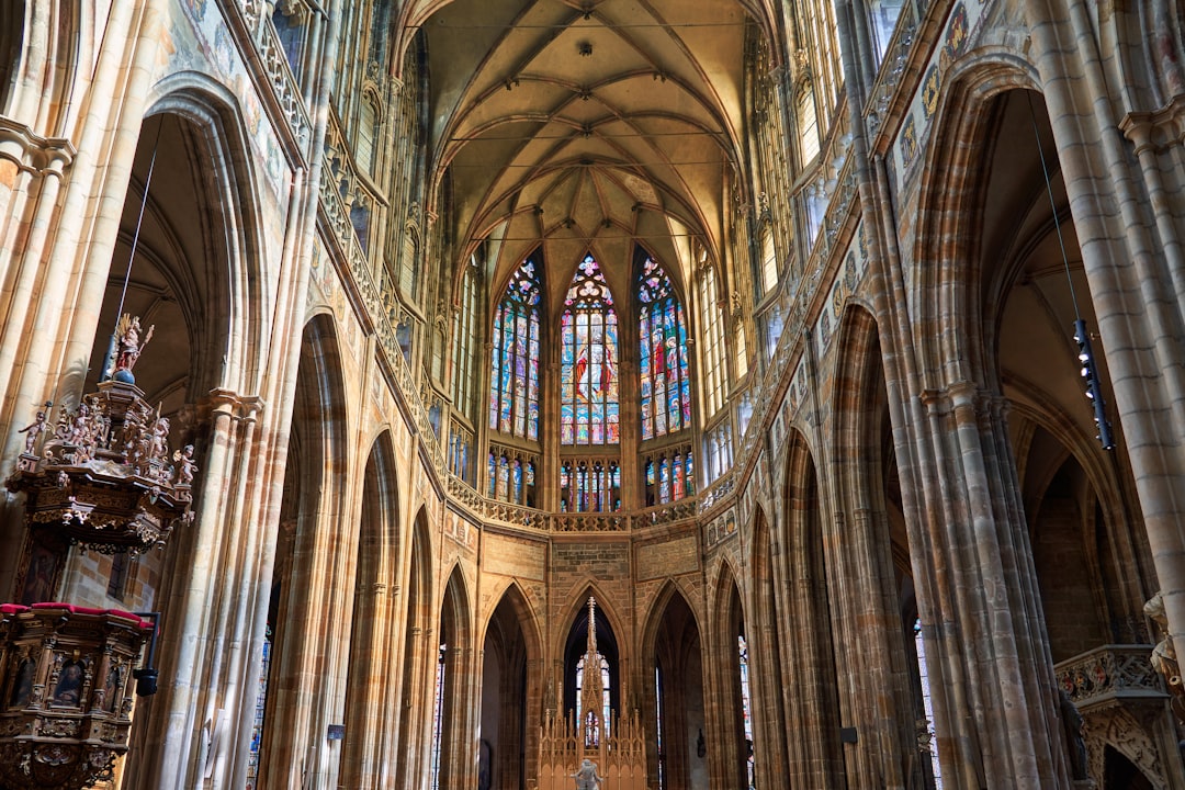 Stad Leykum, St grape cathedral in Prague interior, gothic architecture, tall columns and arches, stained glass windows with intricate patterns, wide shot, high resolution photography. –ar 128:85