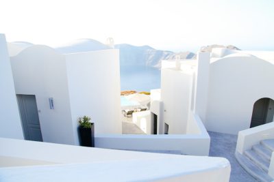 Santorini architecture, white buildings with views of the sea, photography in the style of Syalid.